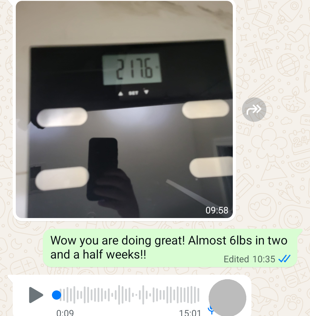Scale photo showing 217.6lbs, coach notes almost 6lbs lost in two and a half weeks